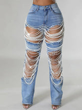 Calça Feminina Jeans Rasgada com Strass